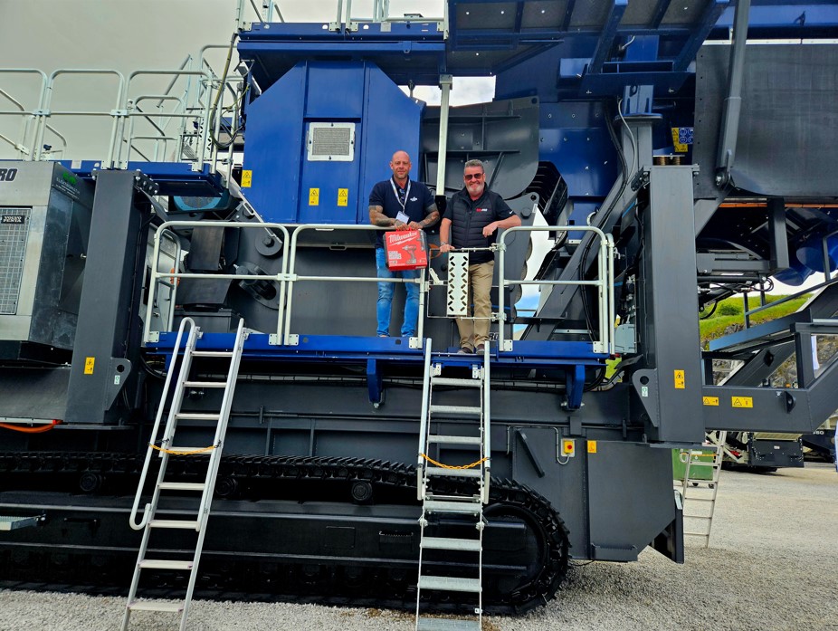 Agg-Pro Sales Director Tom Elgin with competition winner Dan Killner at Hillhead